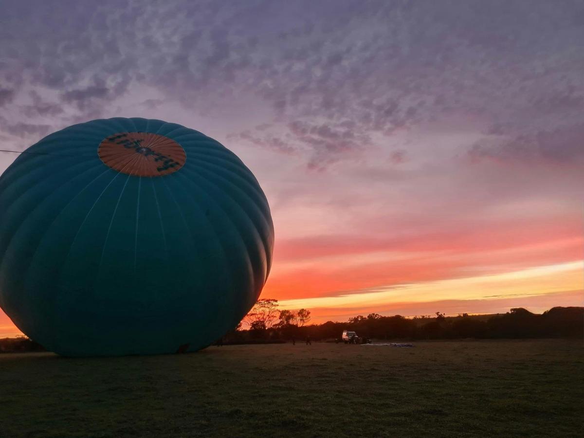 Balloon inflation with breathtaking colorful sky during early morning flight preparations