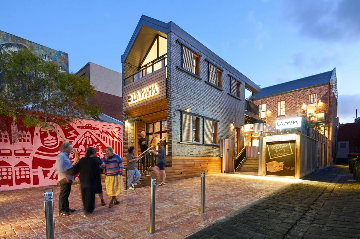 The forecourt in front of La Mama Theatre, with Aretha Brown's stunning mural to the left.
