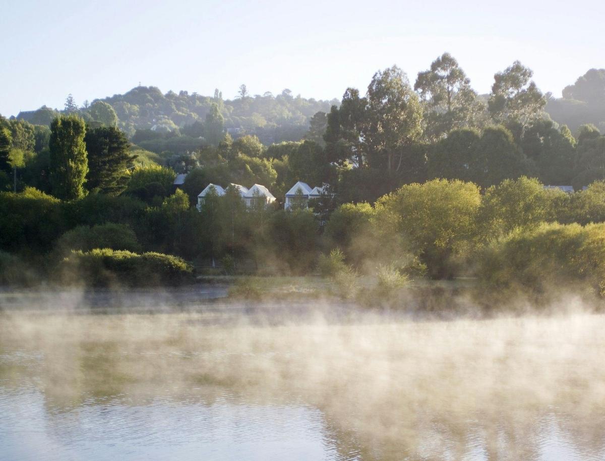 Lake House across the misty lake