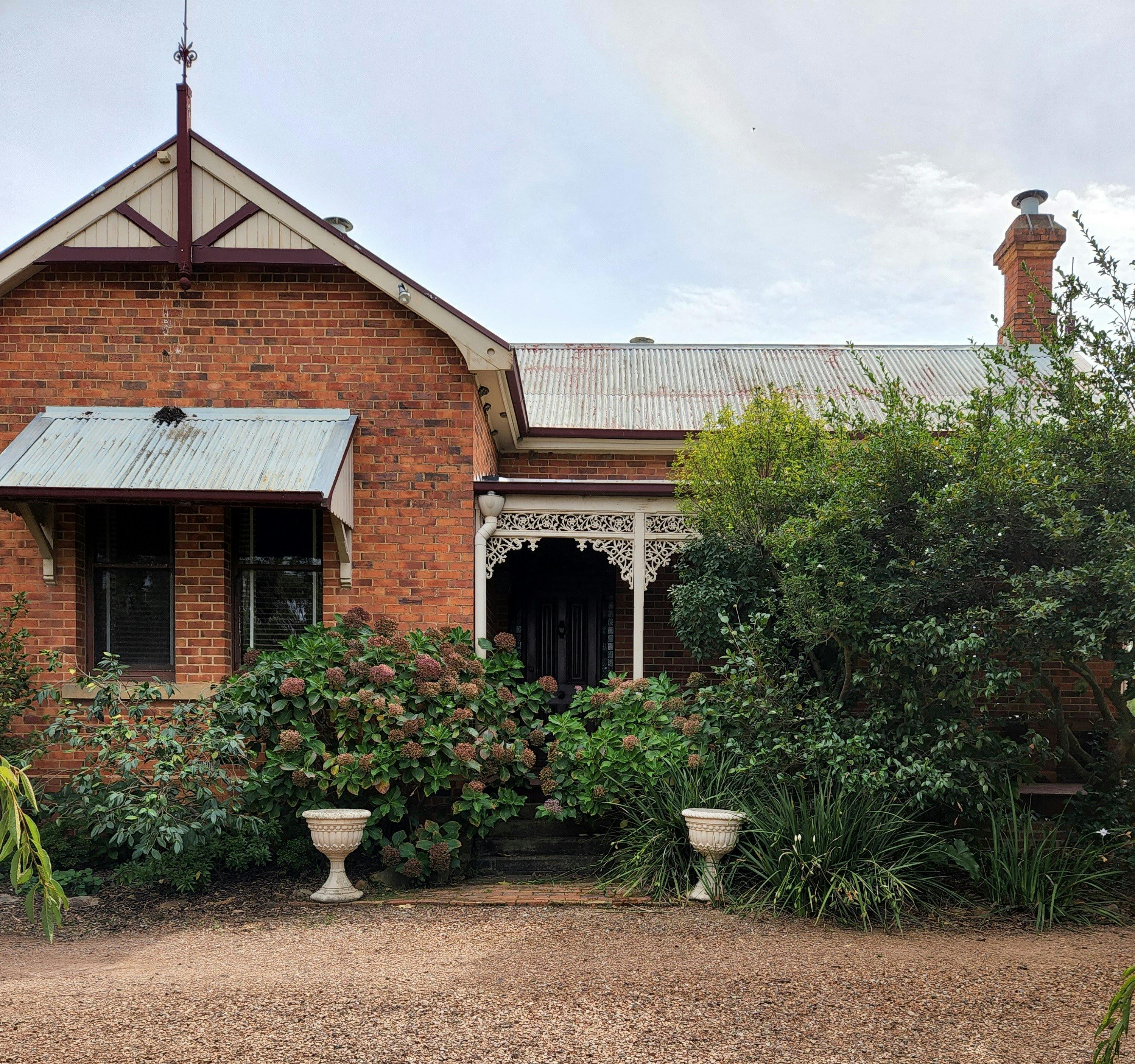 exterior of a house with bushes in the foreground