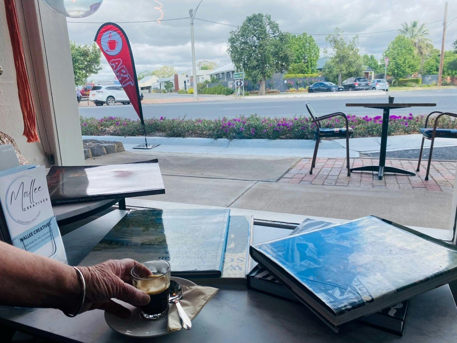 Coffee and books placed on the table