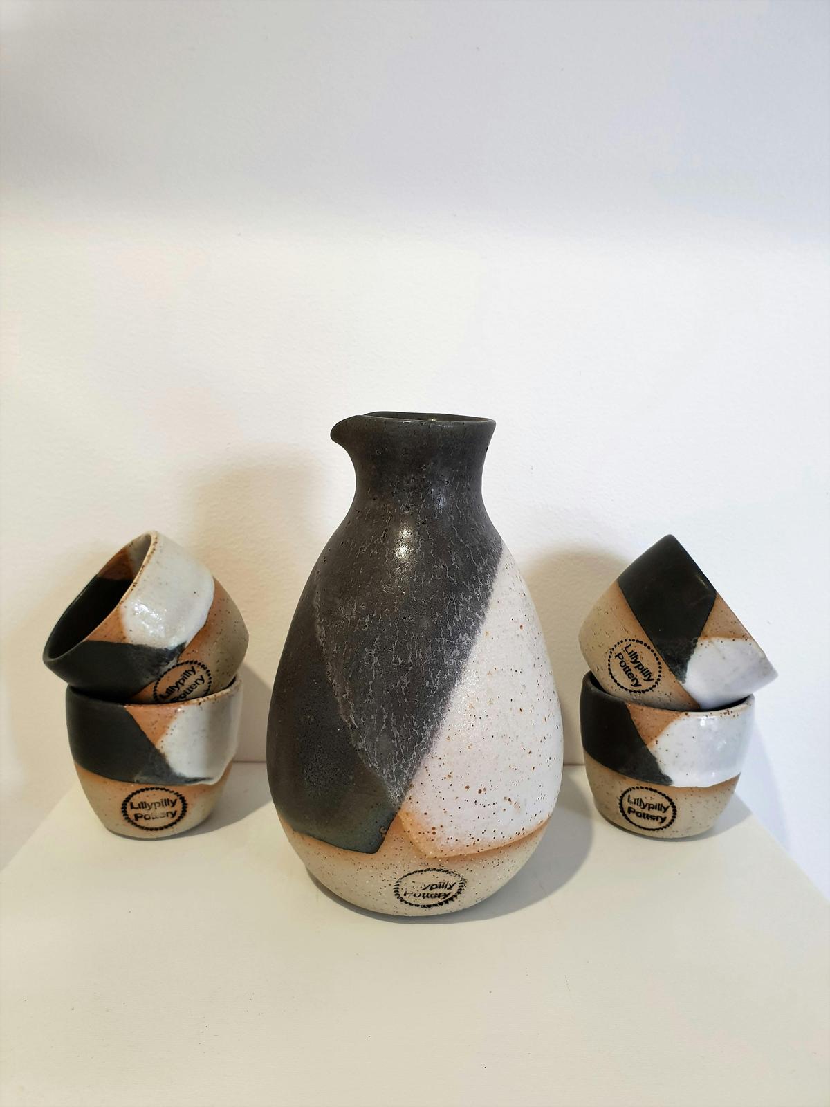 Sake Set complete with bottle and four cups would be perfect for Sake or any liquor served in a shot