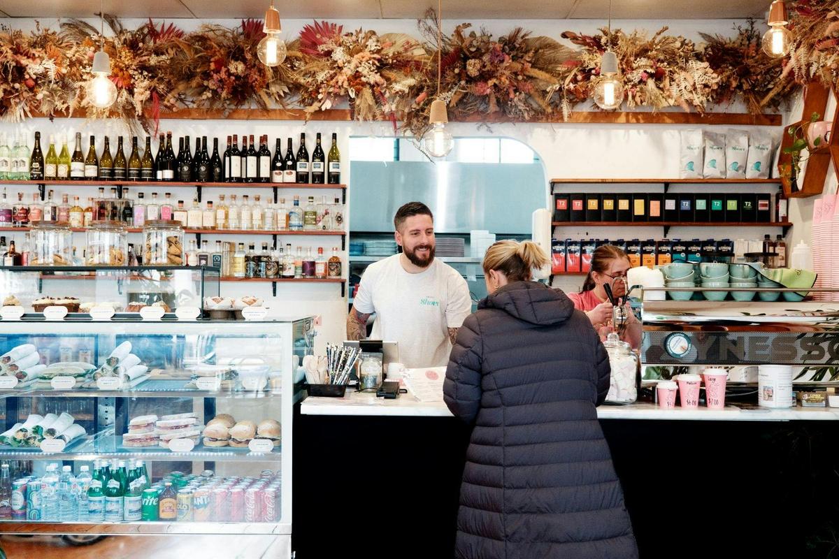 Staff member talking to a customer at the counter