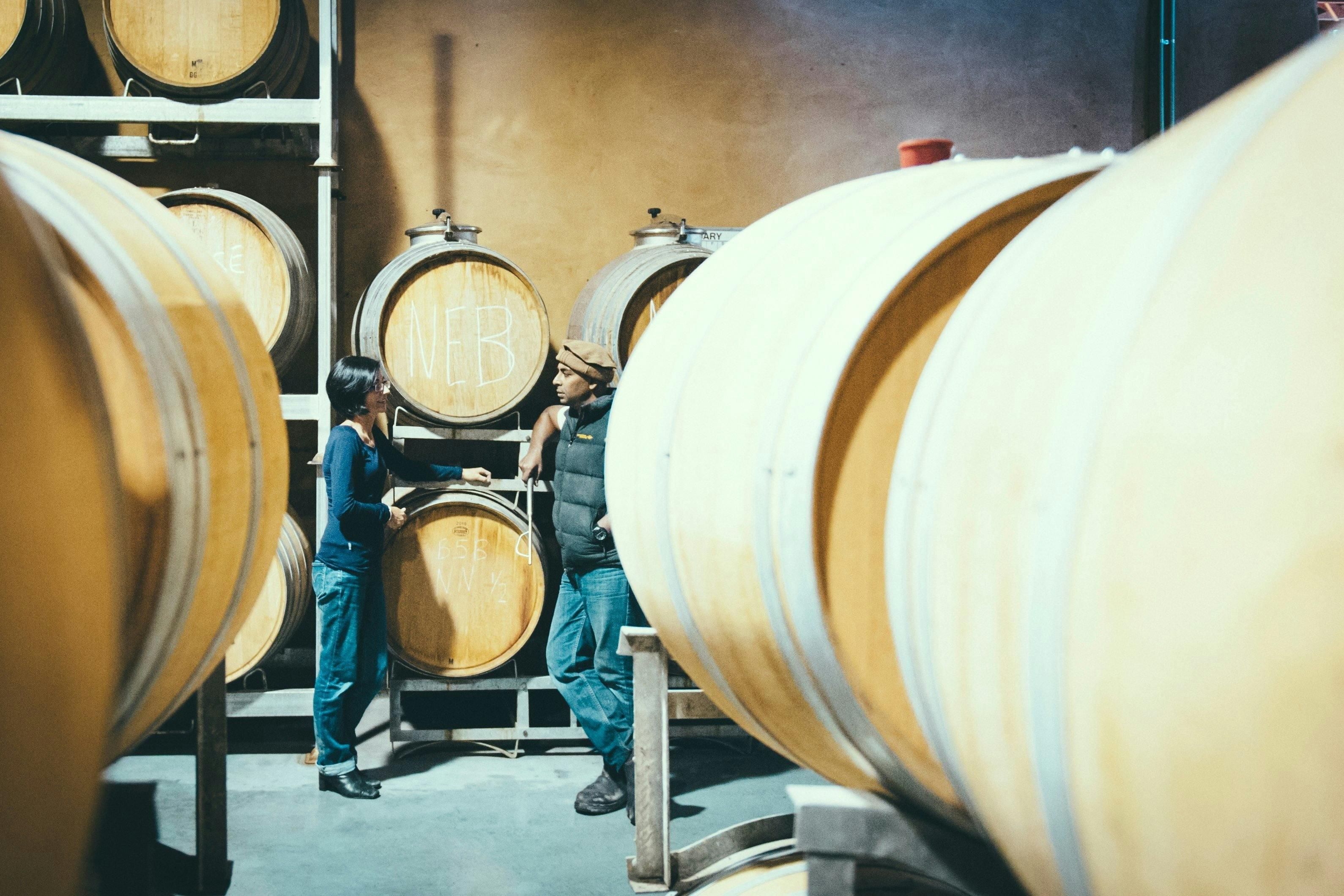 Maree & Ray discussing Nebbiolo in barrel in the winery