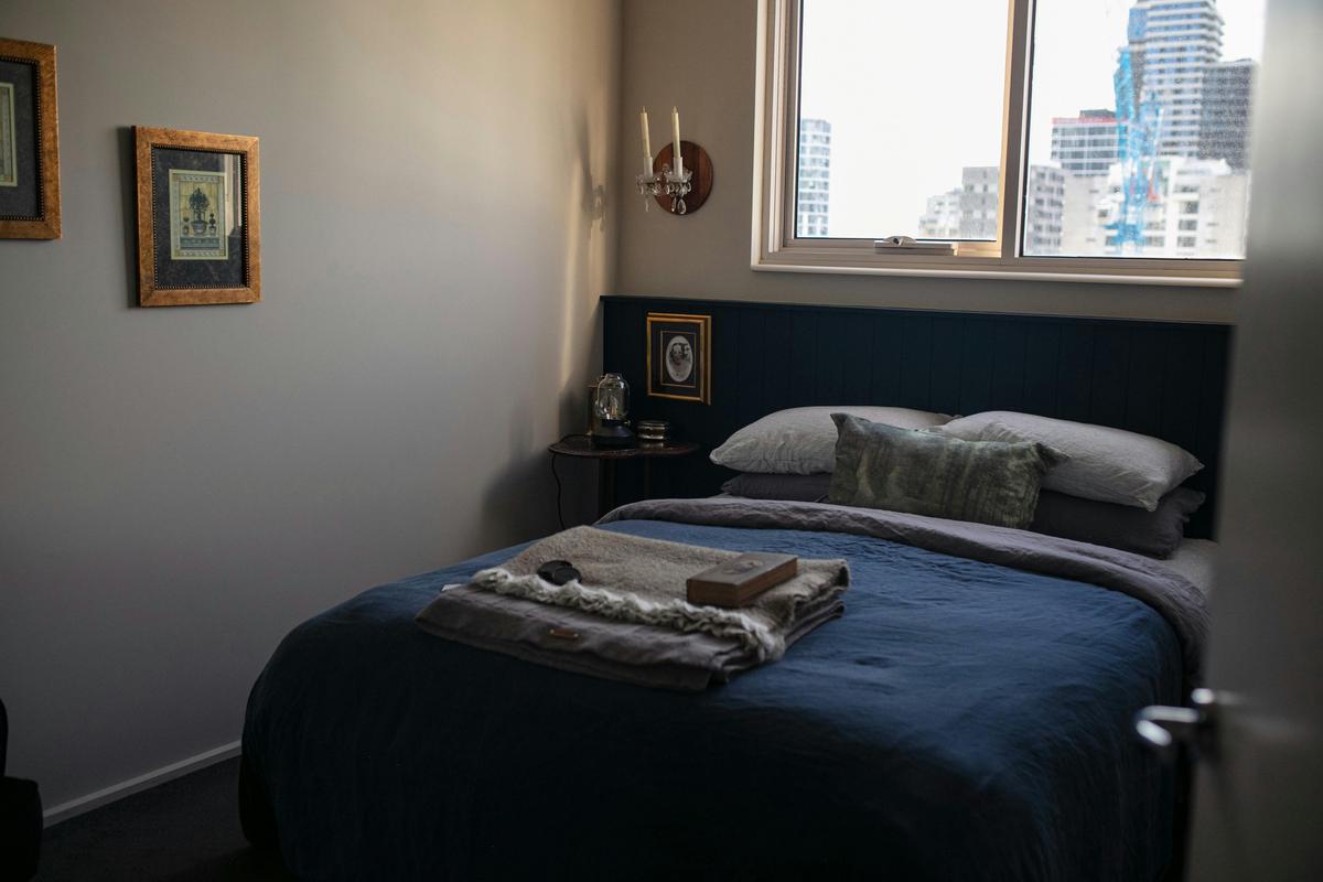 Master bedroom with queen bed, linen sheets and pillow menu