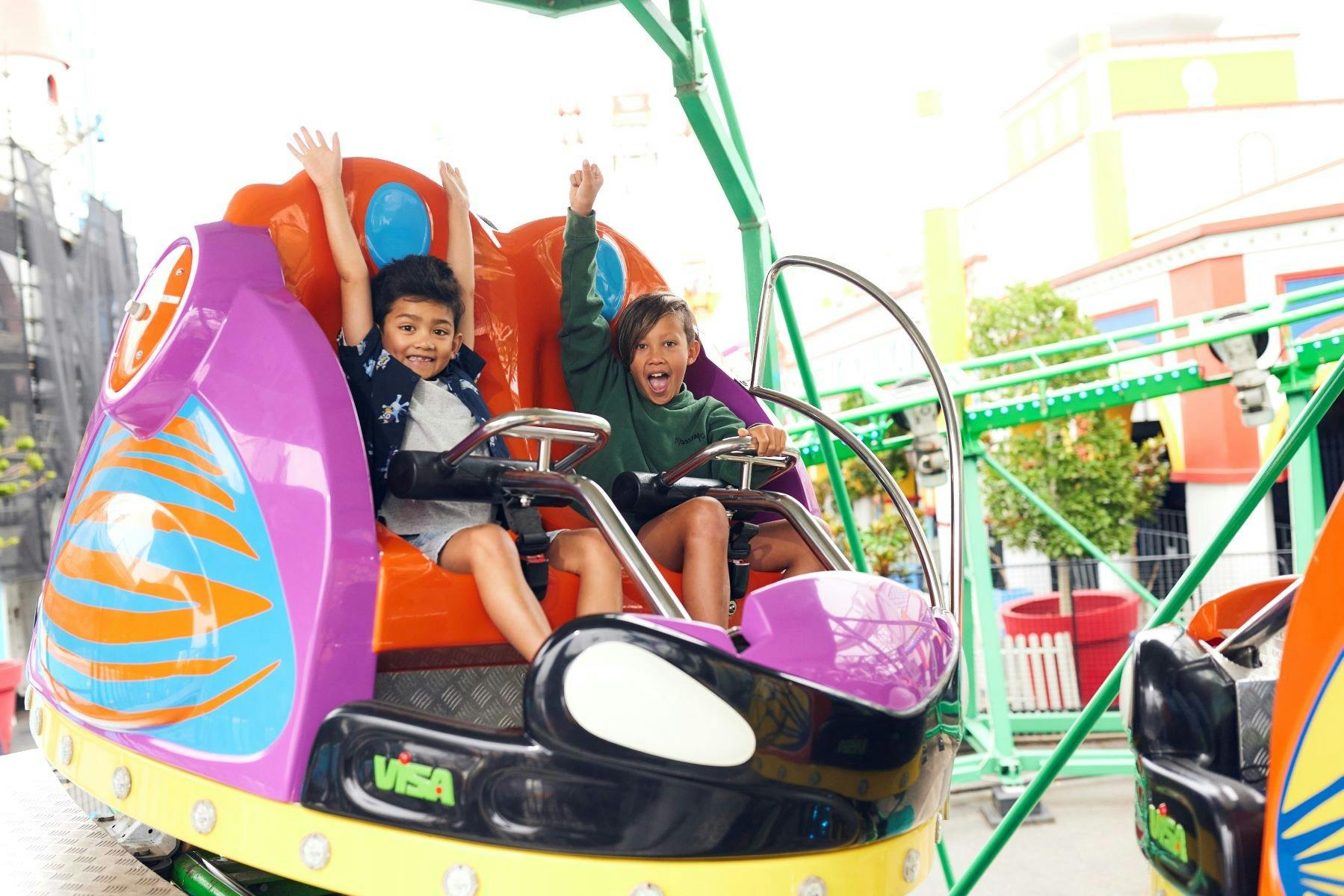 Kids on Speedy Beetle Luna Park Melb
