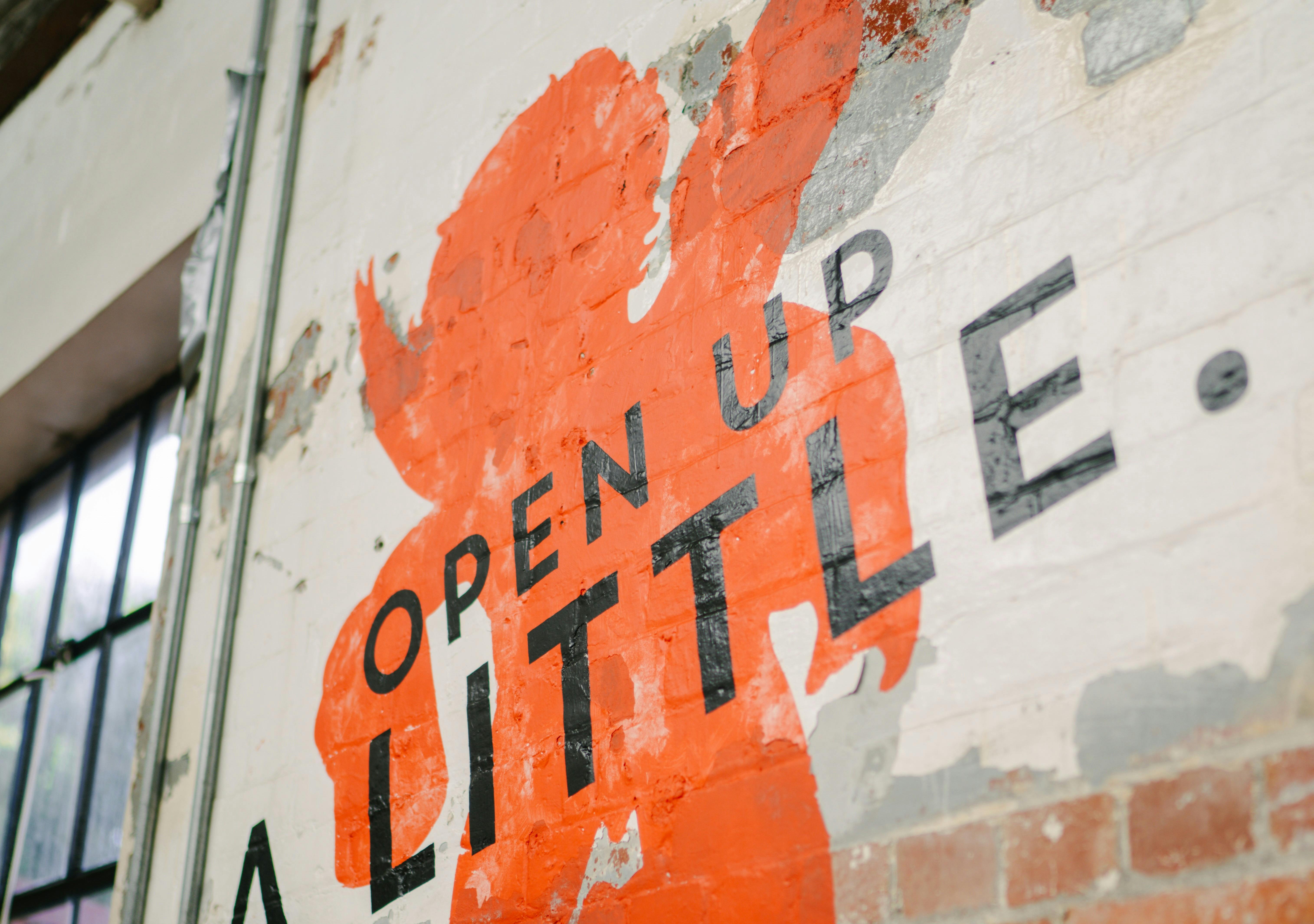 Red cherub with black open up a little. text