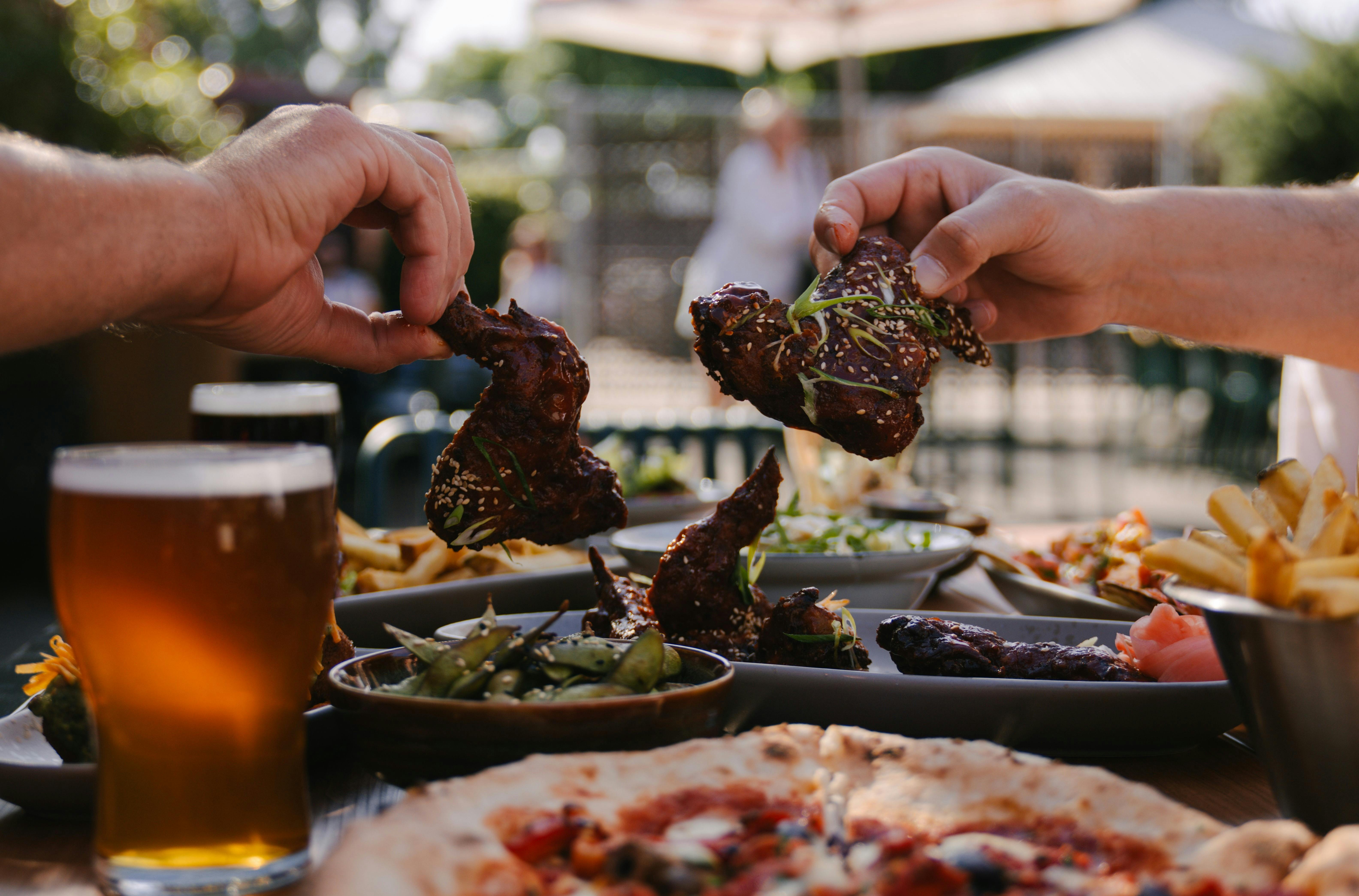 Food spread with chicken wings focus