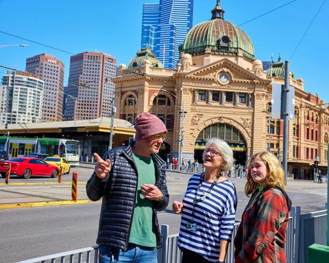 Visitors being shown the city by a volunteer at the Melbourne Greeter Service