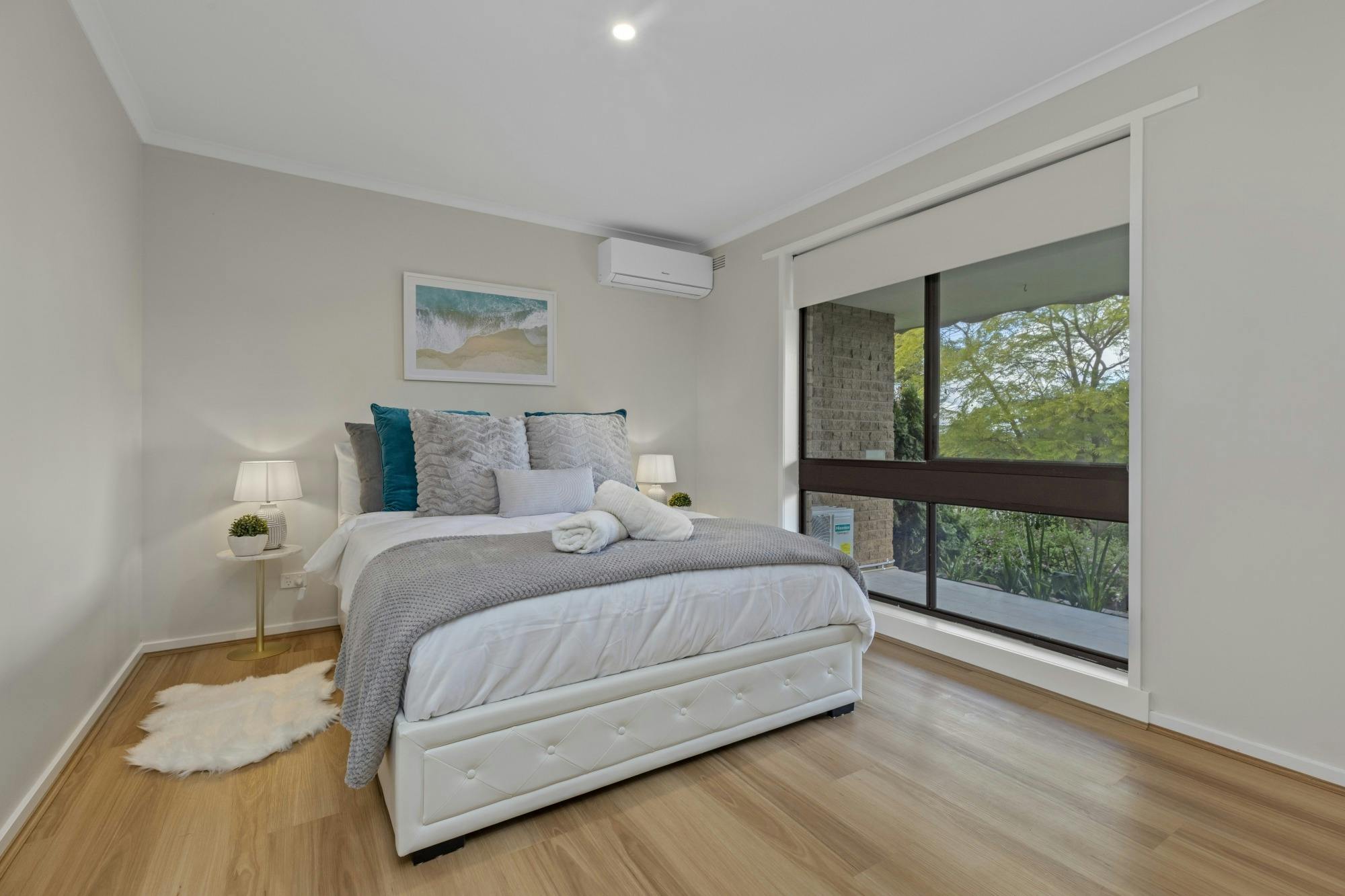 Spacious master bedroom in pet-friendly executive accommodation Bendigo, featuring a king bed, full