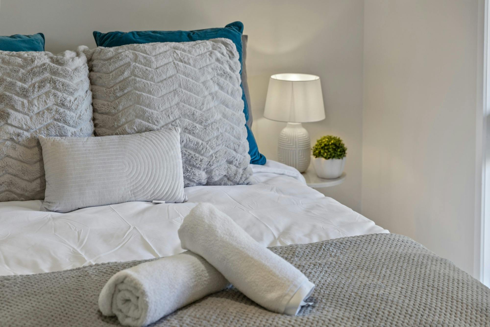 Fully equipped modern kitchen with stainless steel appliances, large fridge, dishwasher, and dining