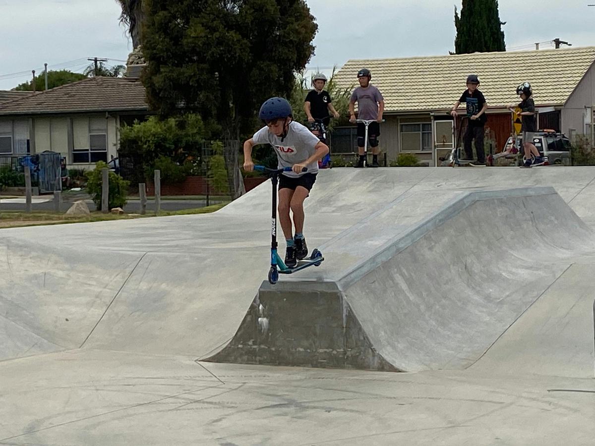 Scooter rider at skate park