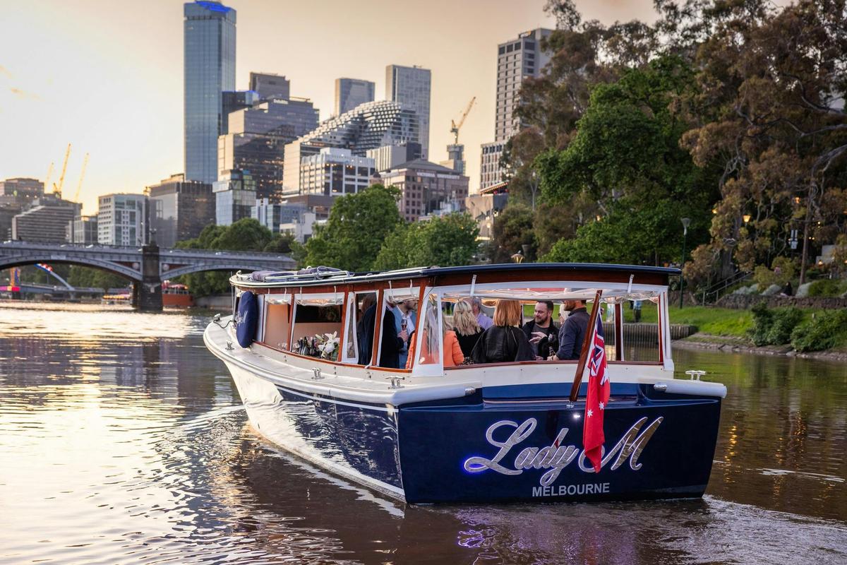 Lady M guests enjoying city views on the Yarra River sunset cruise