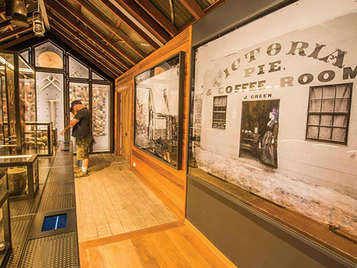 A visitor looks at displays in Hill End Heritage Centre. Photo: John Spencer/OEH.