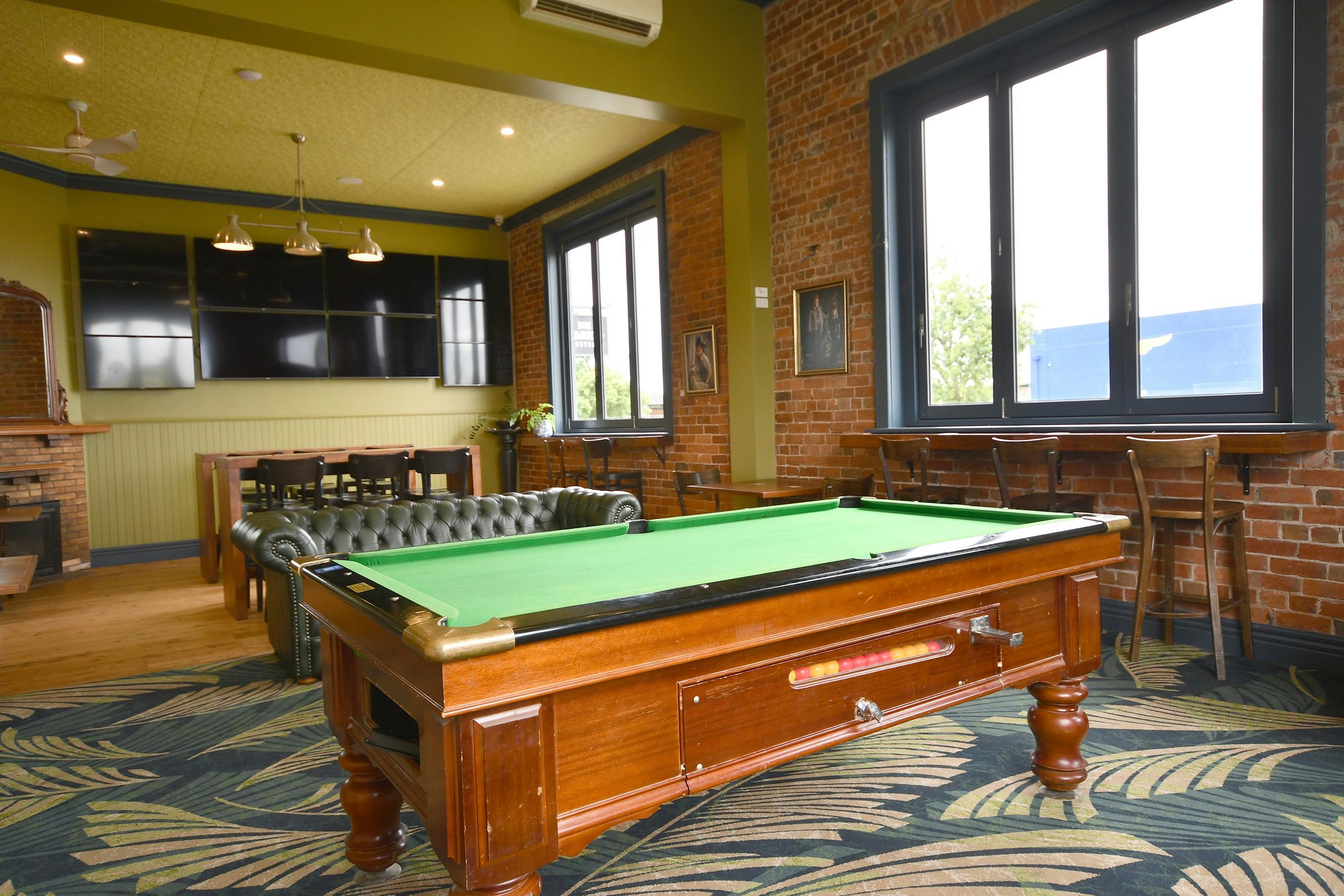 Sports bar with TVs and pool table