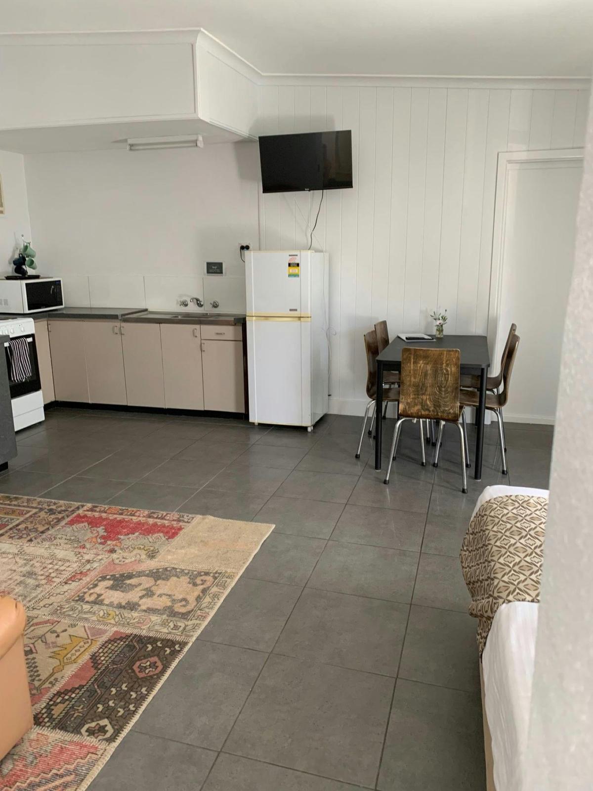 Kitchen + dining + single bed