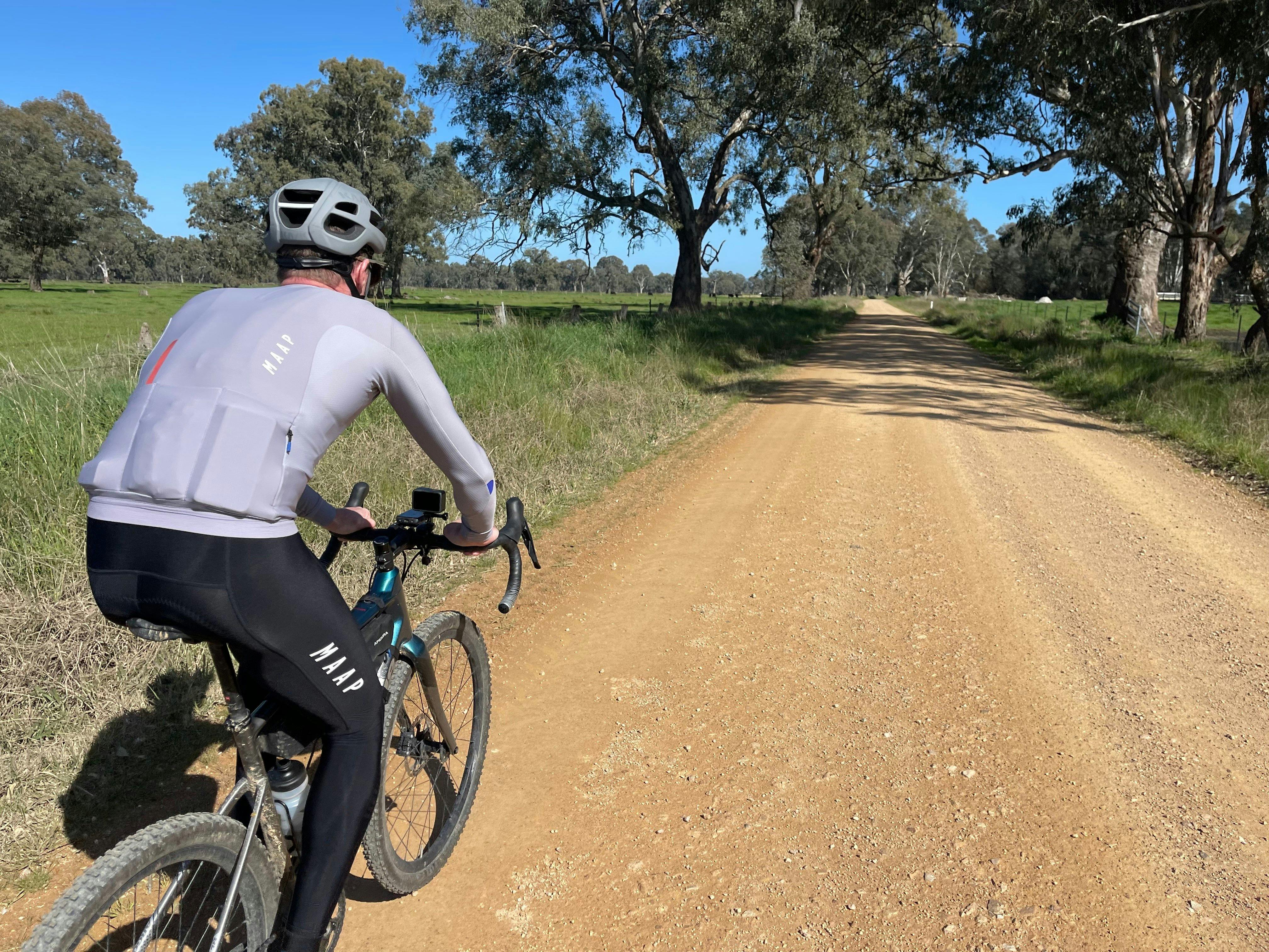 Cyclist on Gravel Road