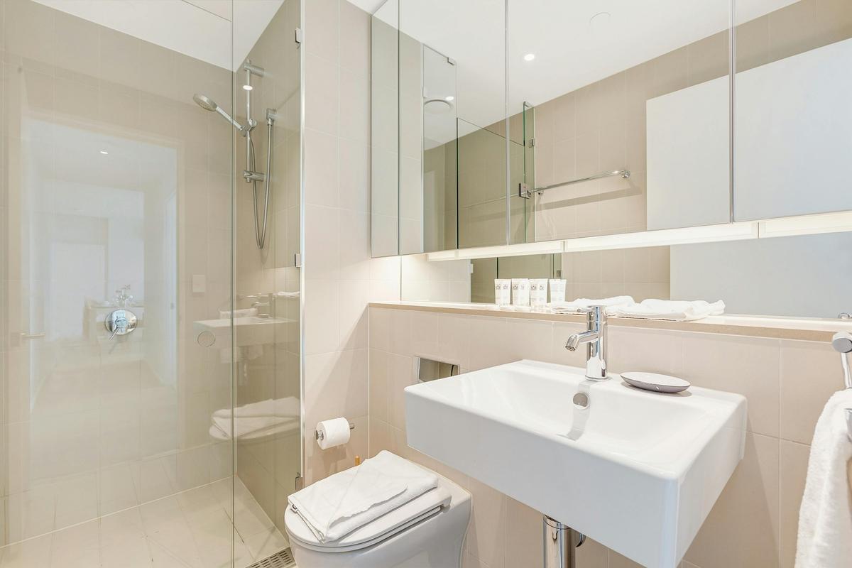 Two bathrooms with walk in shower, toilet and vanity