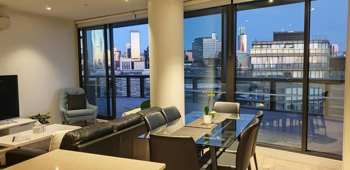 The view as you stand in the kitchen.  What a beautiful sunset reflecting on the city buildings.