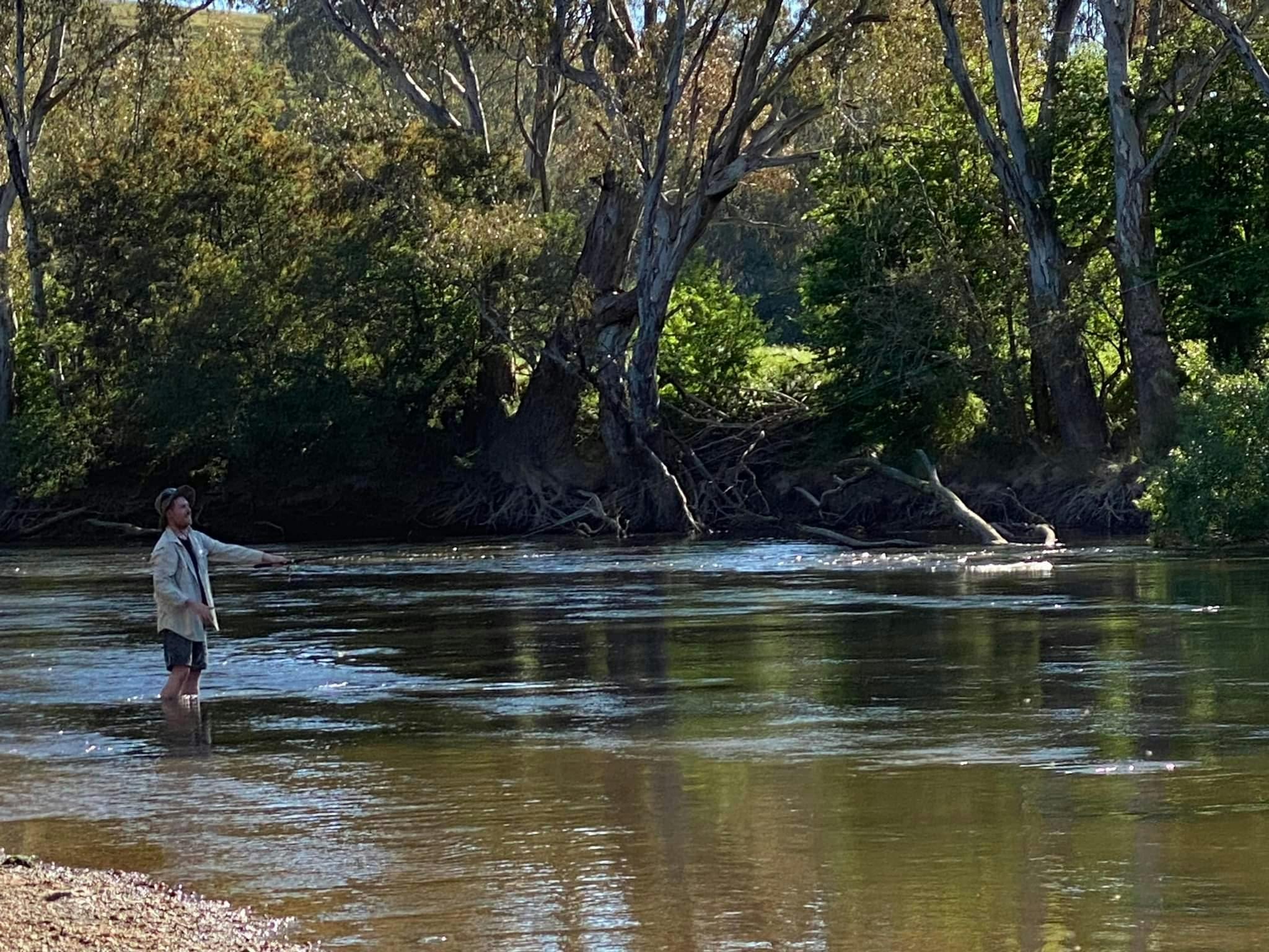 a man Trout fishing in the river