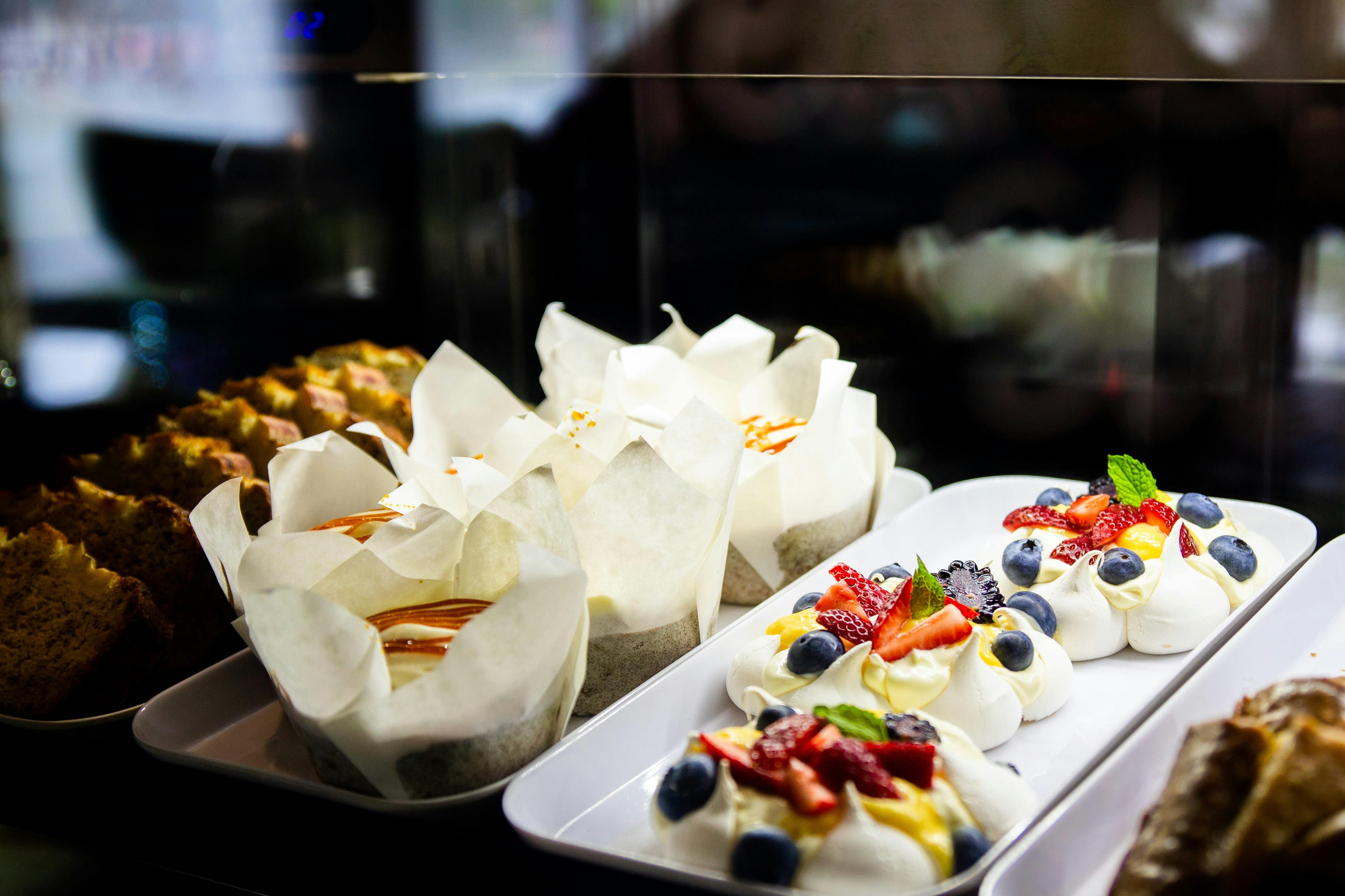 Cakes and slices presented in a display fridge..