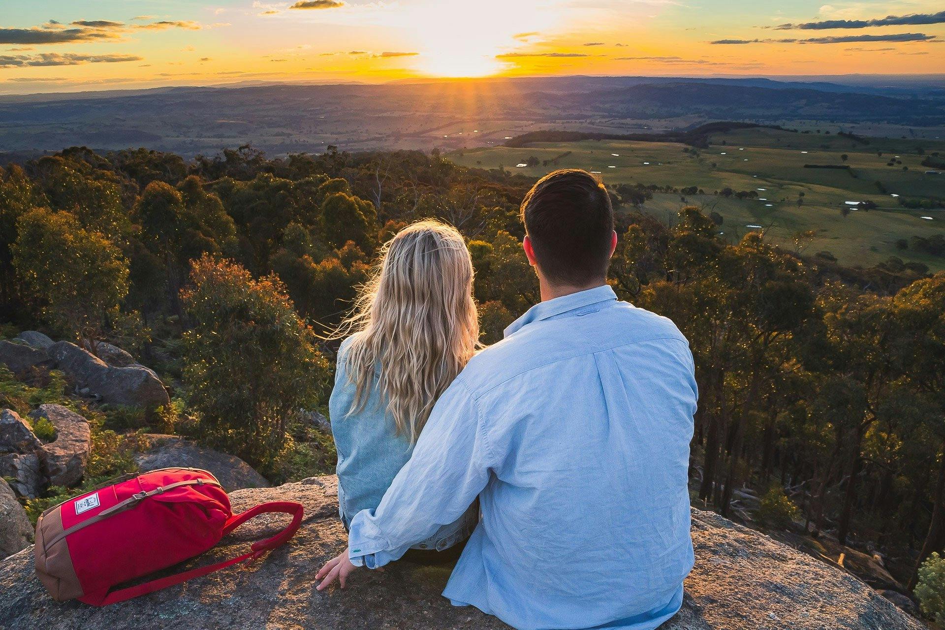 Couple Enjoying sunrise at Mt Wombat lookout