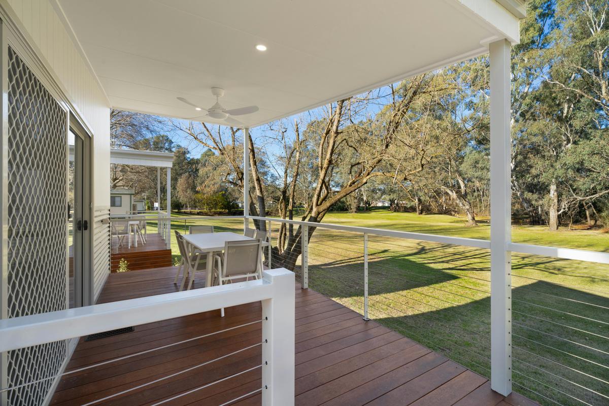 Premium family cabin showing large deck and ramp access