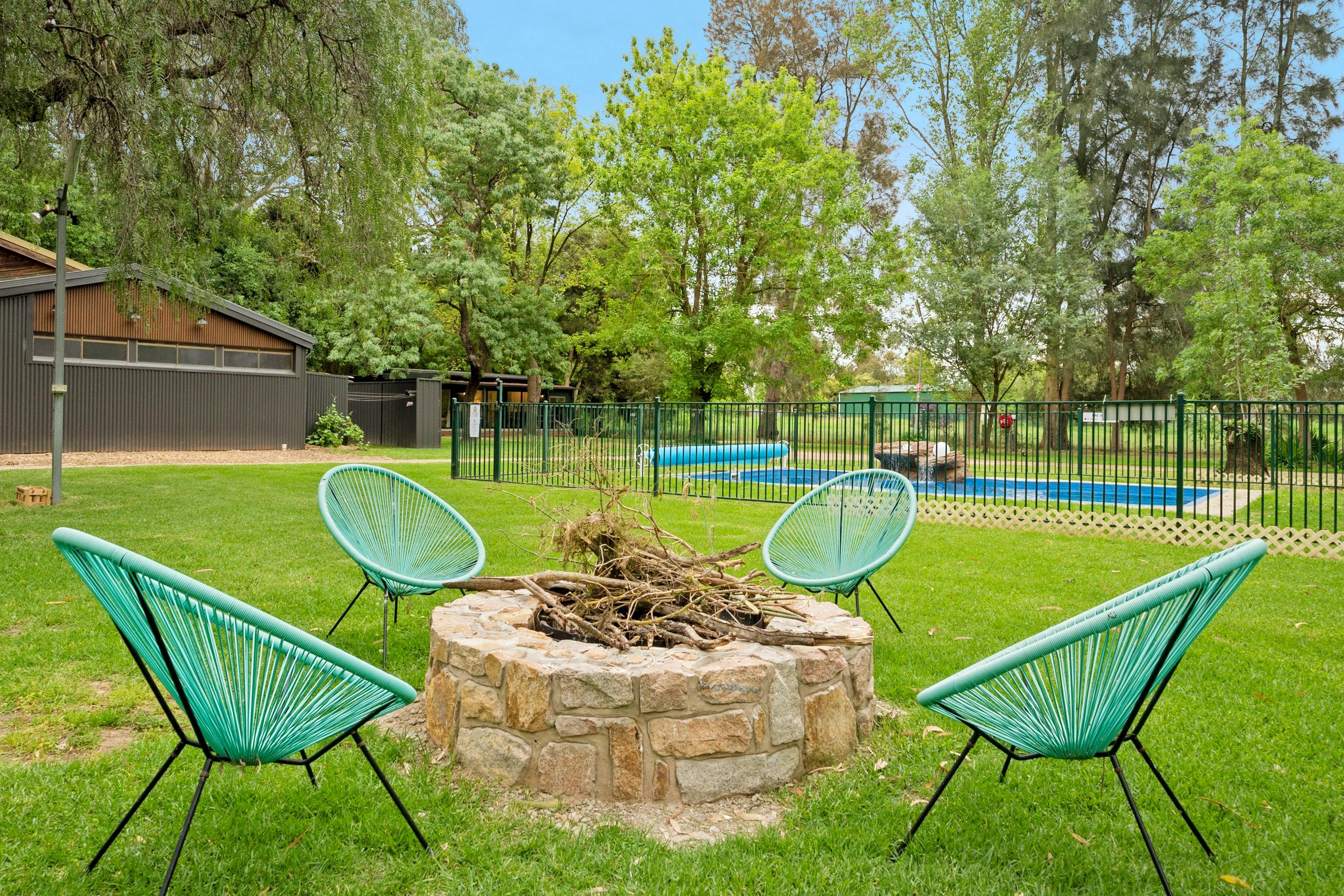 The communal, handcrafted fire pit provides a place to relax together at the end of the day.