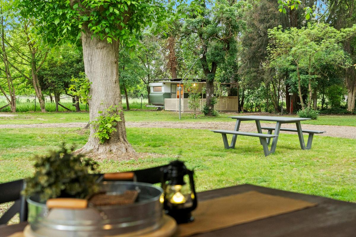 Communal gardens and dining spaces mean you are never jammed in cramped sites at Moyhu Caravan Park
