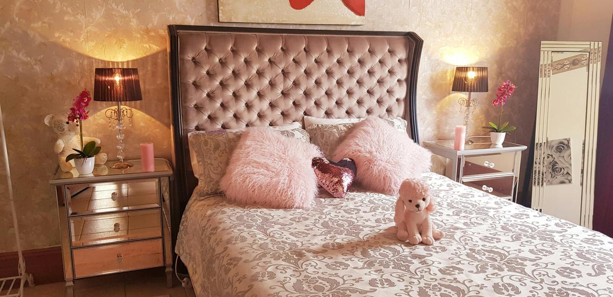 bedroom of the chandelier suite