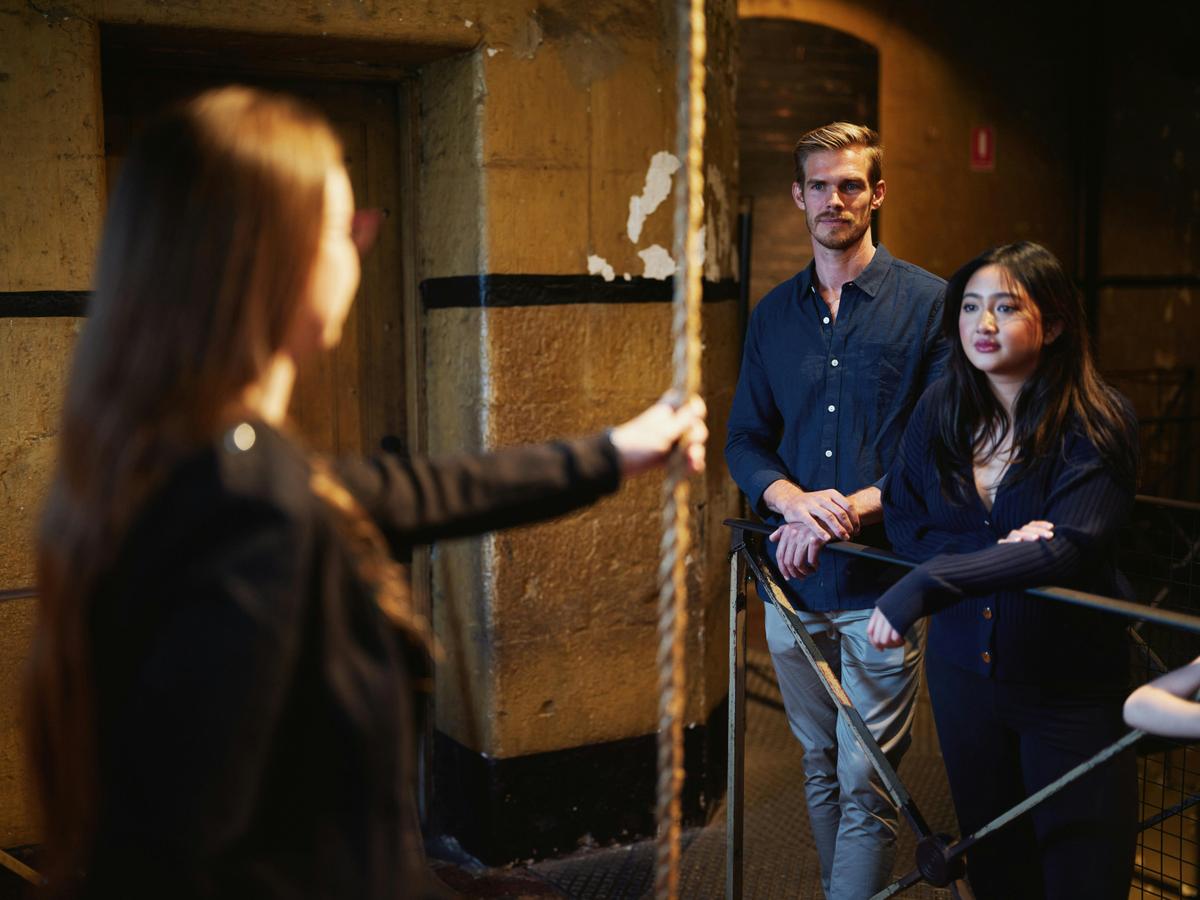 Guide talking to couple on tour