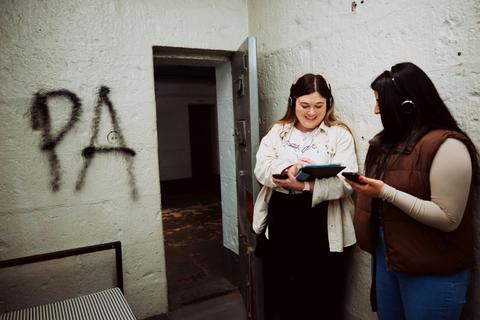 Two people inside a cell