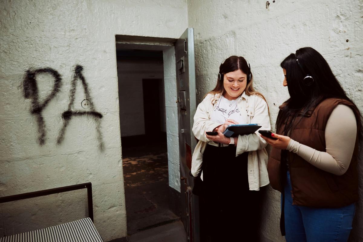 Two people inside a cell