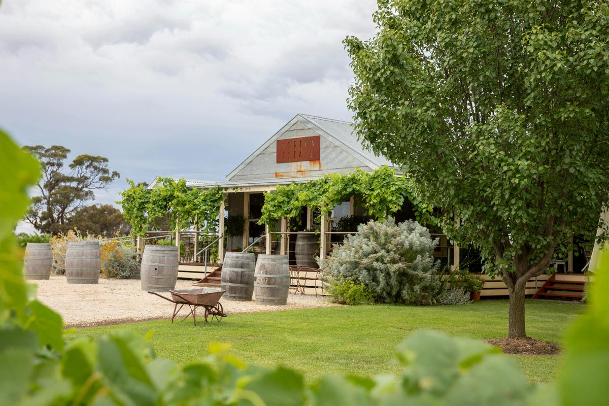 Cellar Door building with wine barrels standing on end