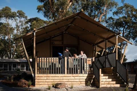 Family enjoying safari tent