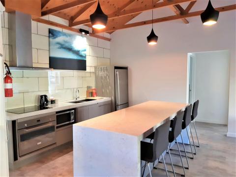 Fully equipped kitchen with bar seating - Apt 4