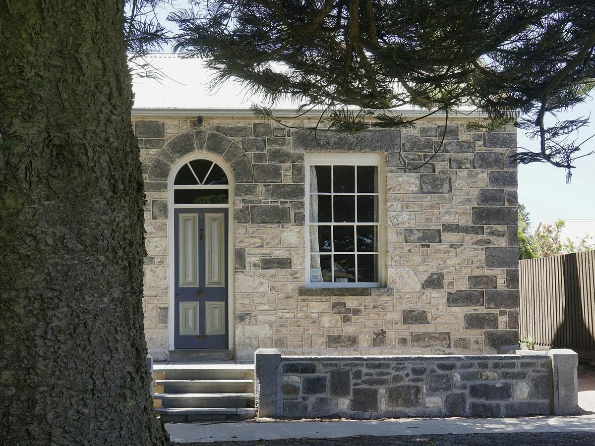 random stone under the giant heritage listed norfolkpine