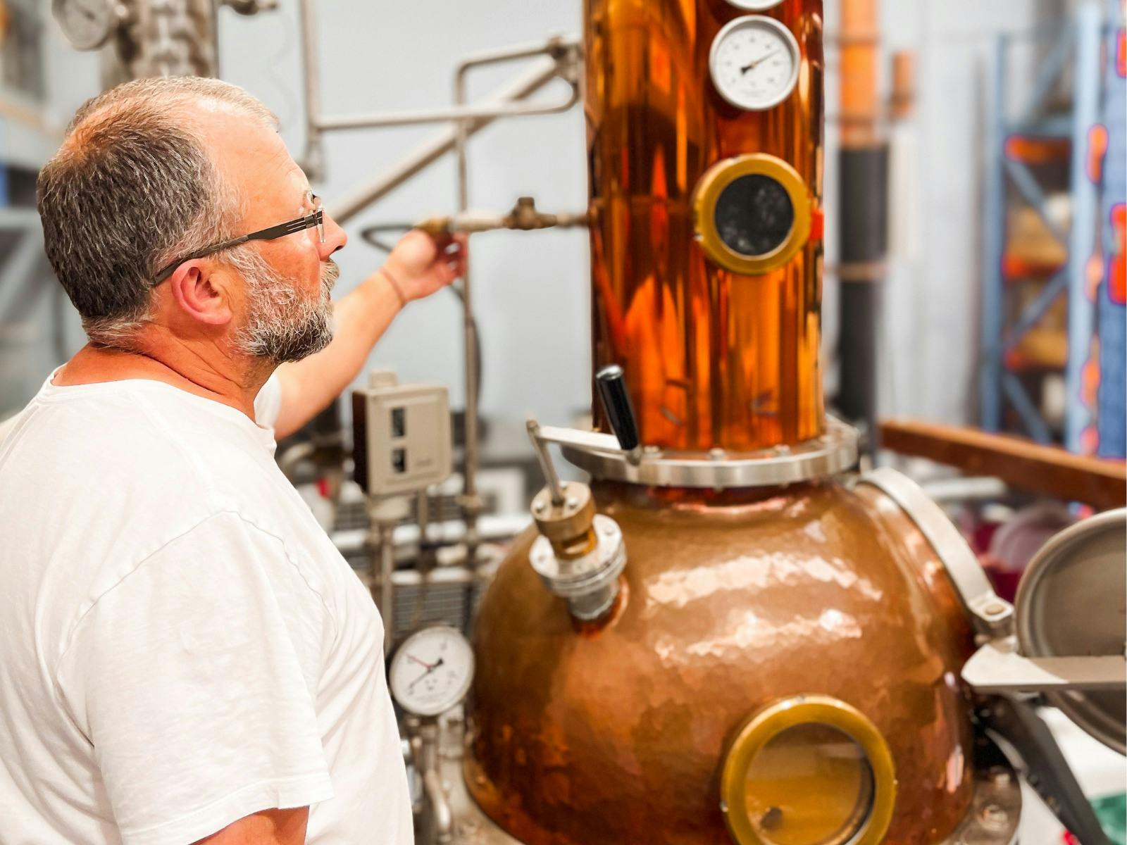 Founder Christoph adjusting Copper Still while his making Limoncello