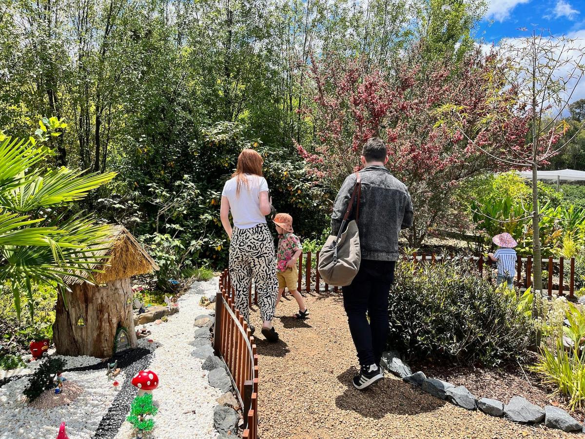 family in the miniatures garden at oasis berry farms