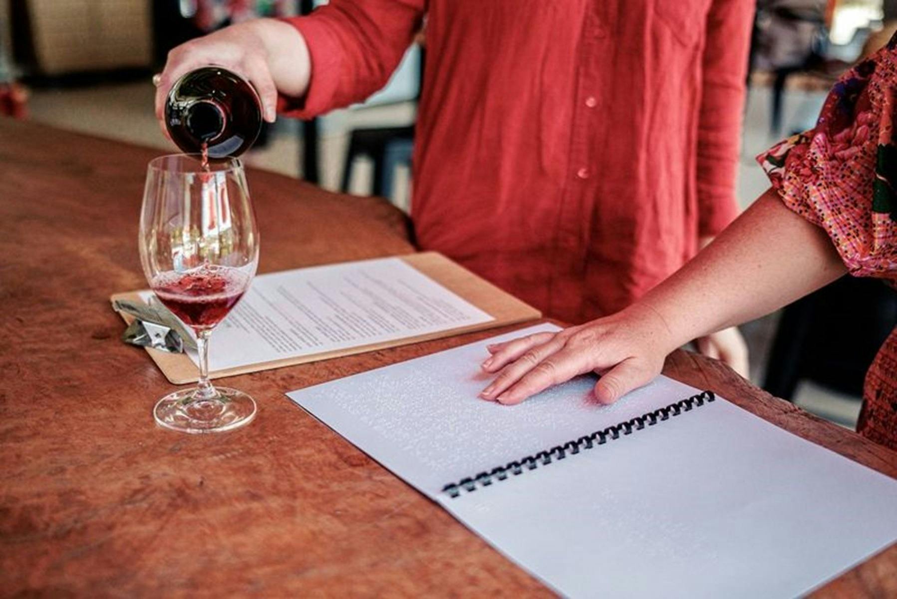 Two people attending a wine tasting experience