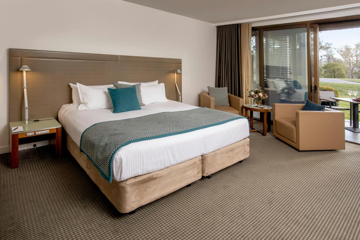 King size bed, couches and golf course views