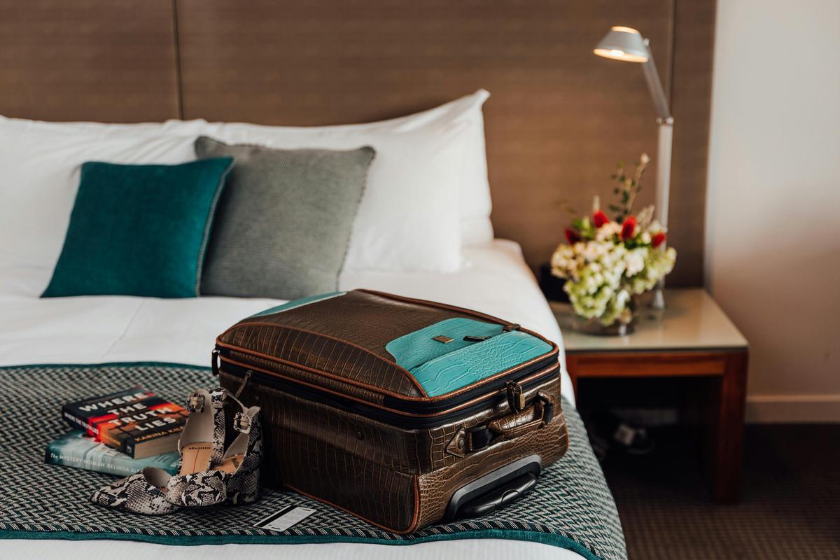 Suitcase on bed