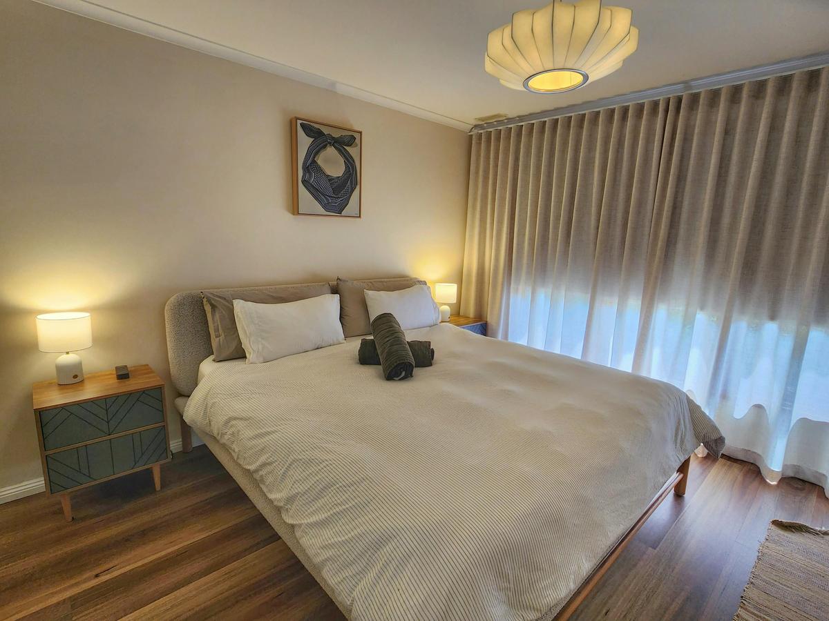 Main bed is king-size and new, large sliding robes, electronic block-outs and curtains