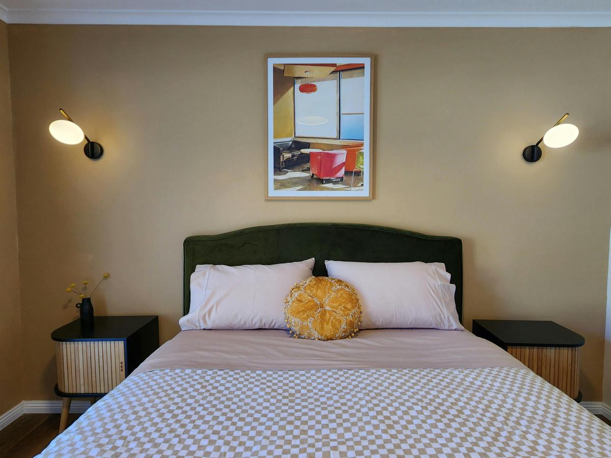 Queen bed has large robes and dressing table, electronic blockout and screening blinds