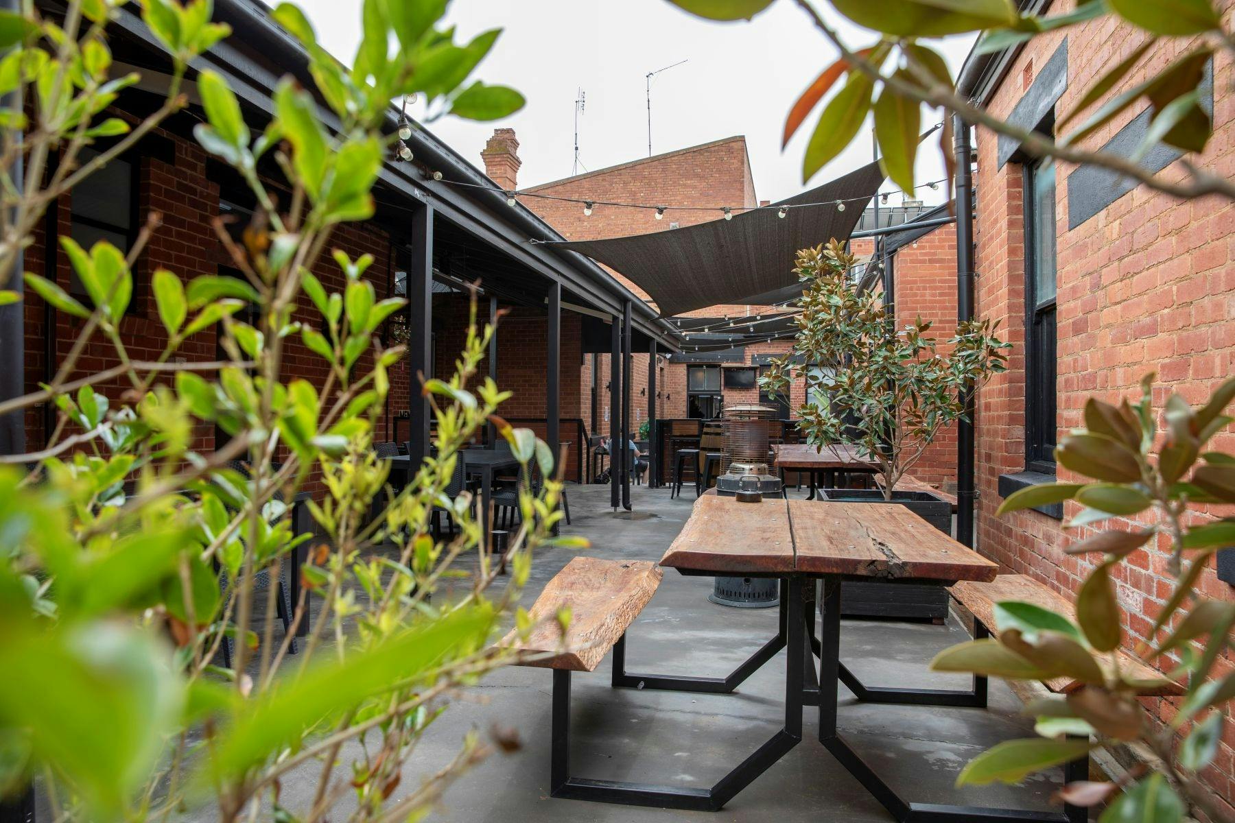 Courtyard area with tables and chairs at a country hotel