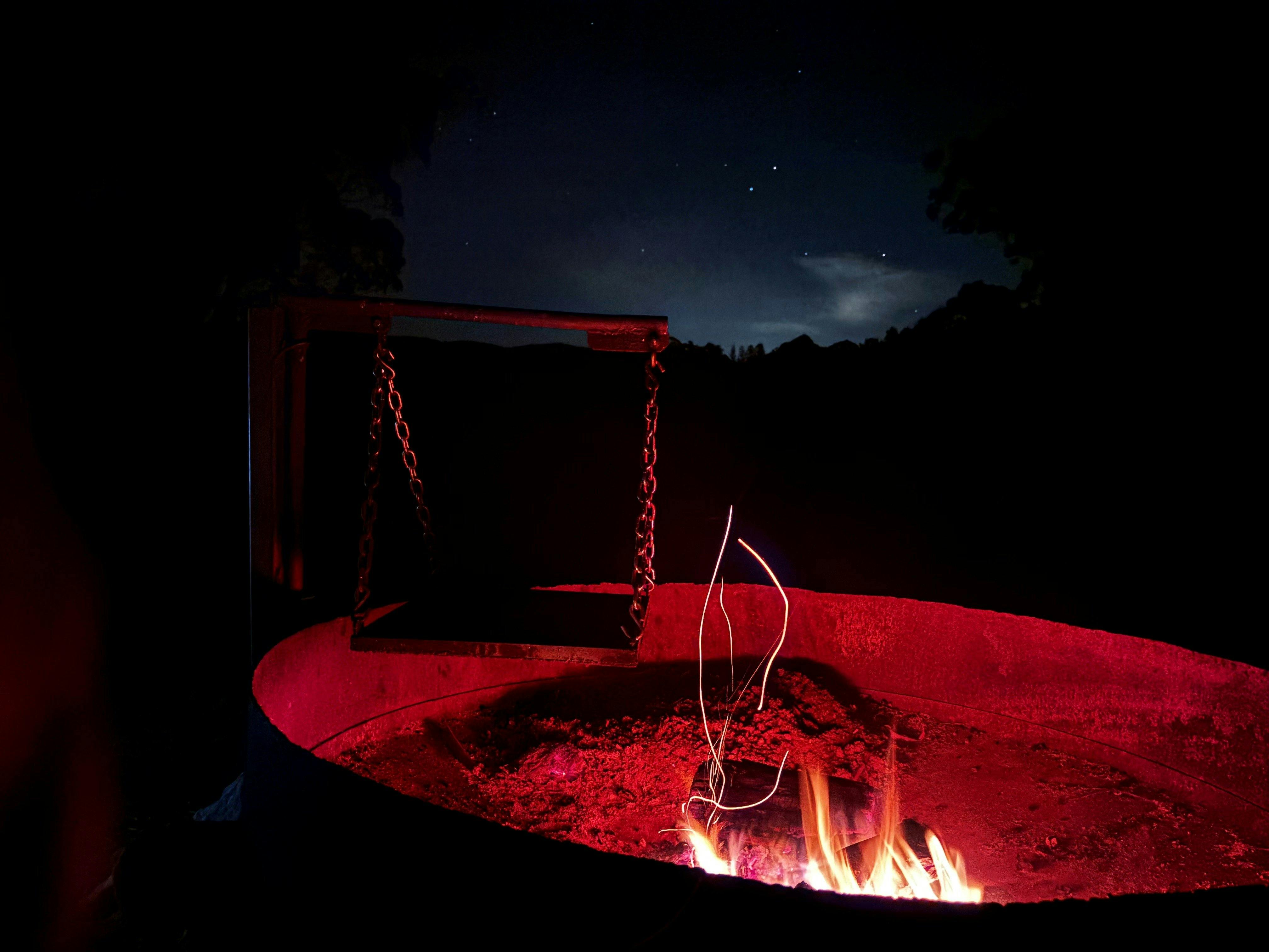 Enjoy sitting by the fire and cooking up your meal on the swing over hot plate