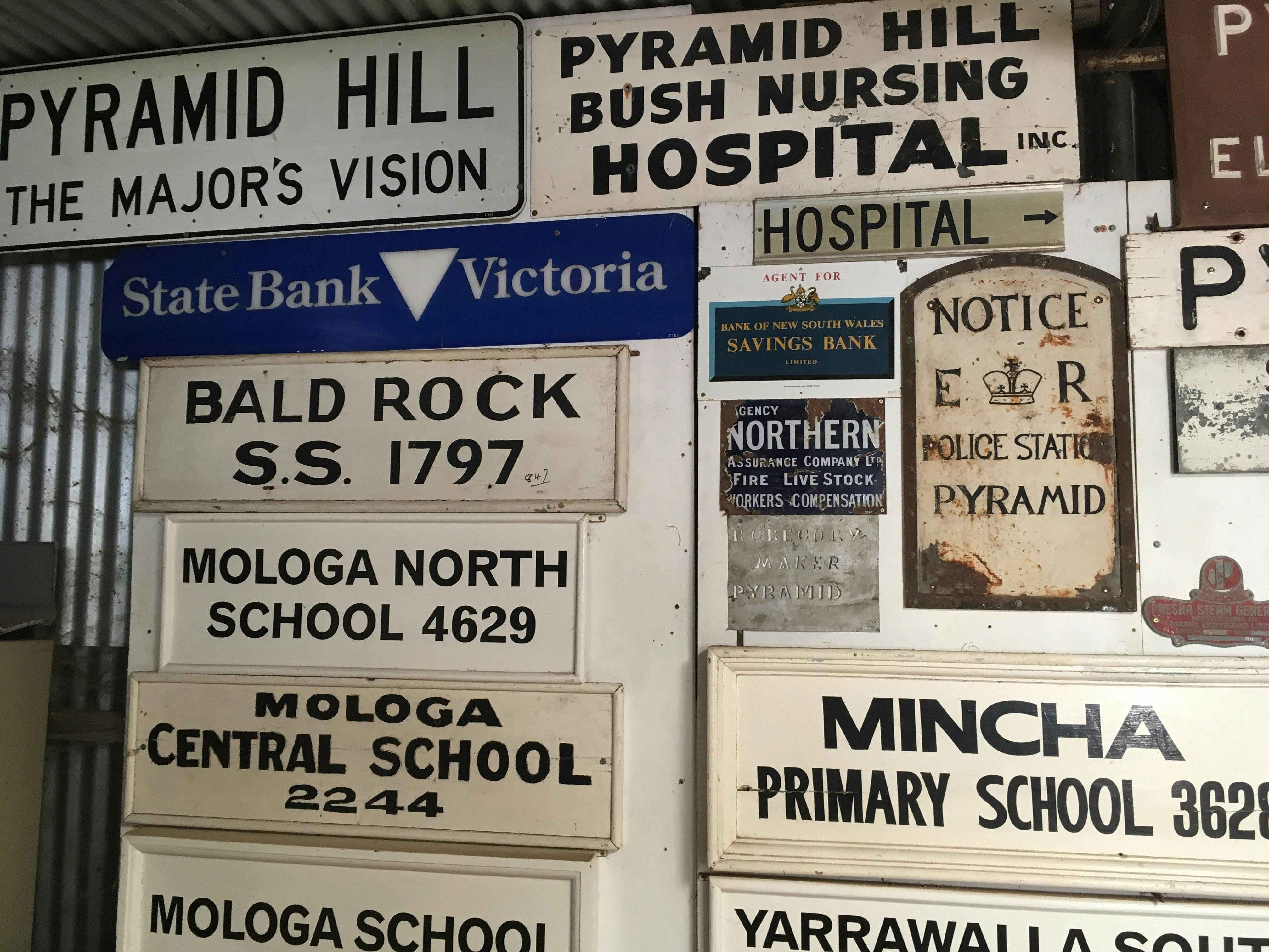 Signs from around the Pyramid Hill district.
