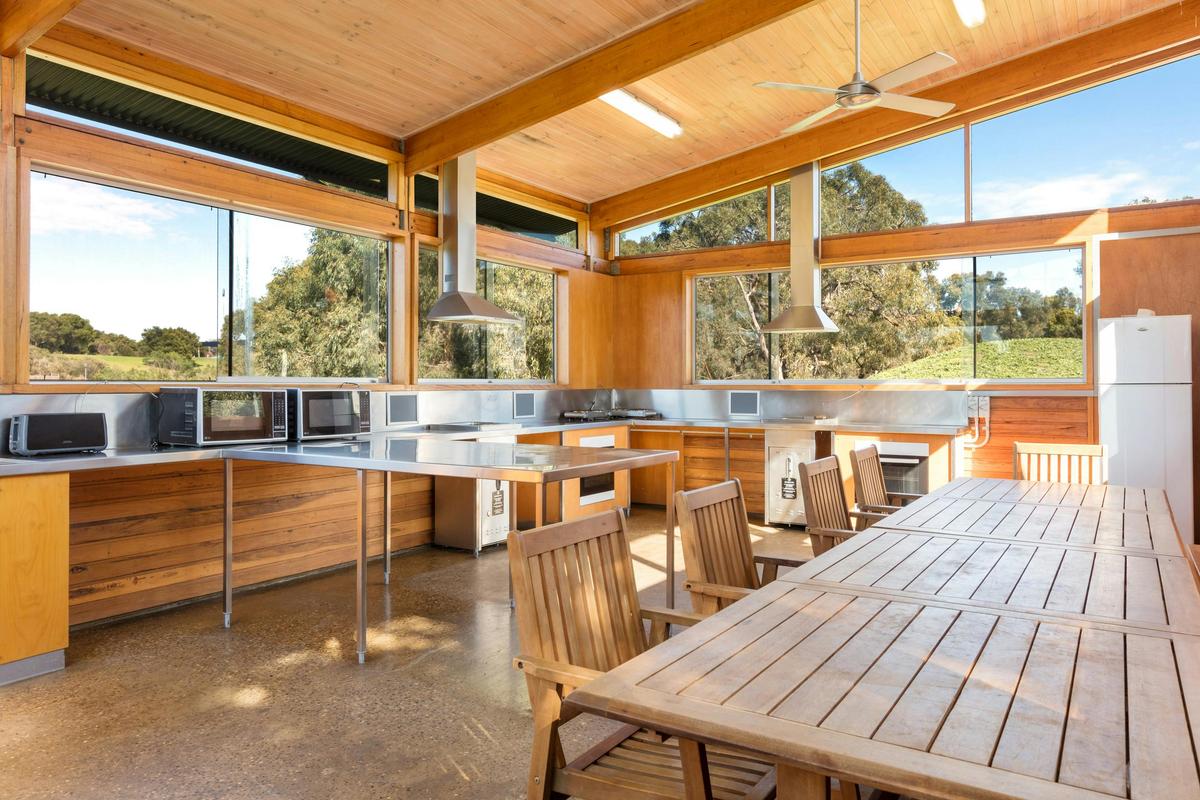 Camp kitchen complete with hot water, fridge, microwave, stove, electric BBQ