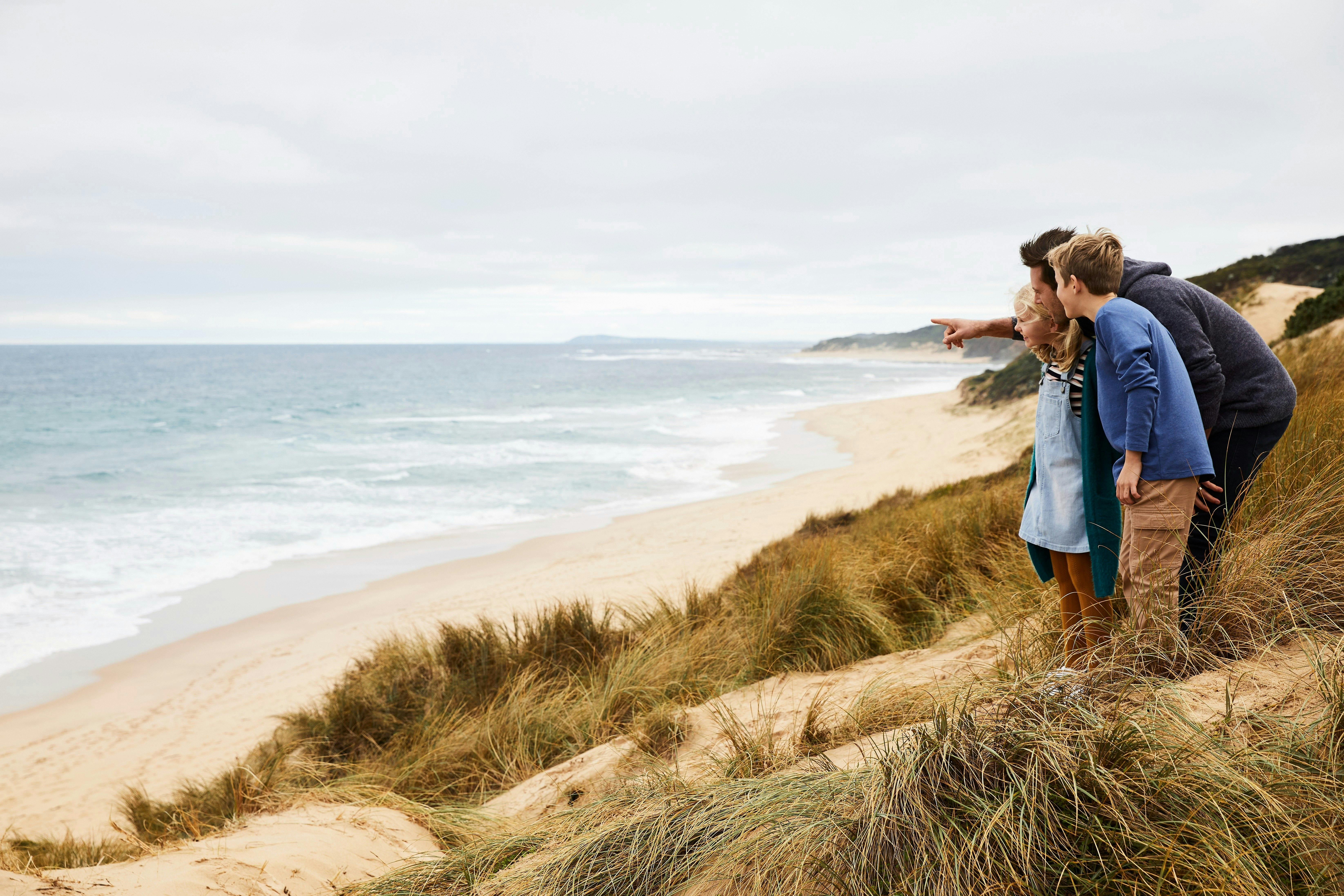 Family exploring beach