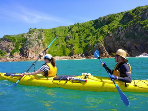 Paddling past granite cliffs near Cape Woolamai on a Phillip island Sea Kayak Tour